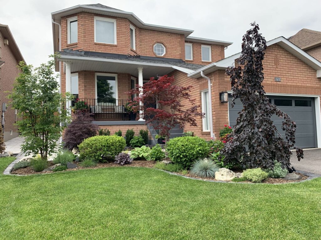 Front yard makeover with trees & planting designs and new stone stairs Caledon